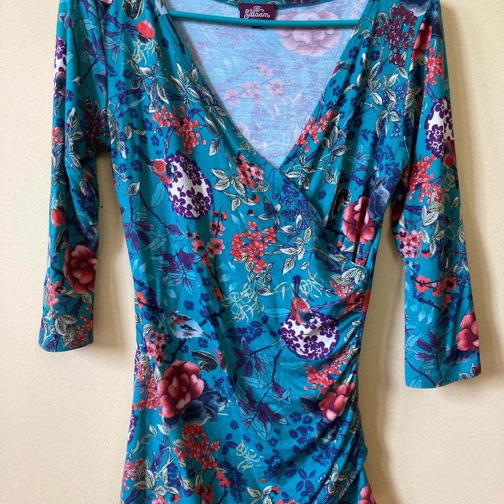 $7 w/purchase of any other item. Salaam Wrap Front 3/4 Sleeve Top Teal Floral XS